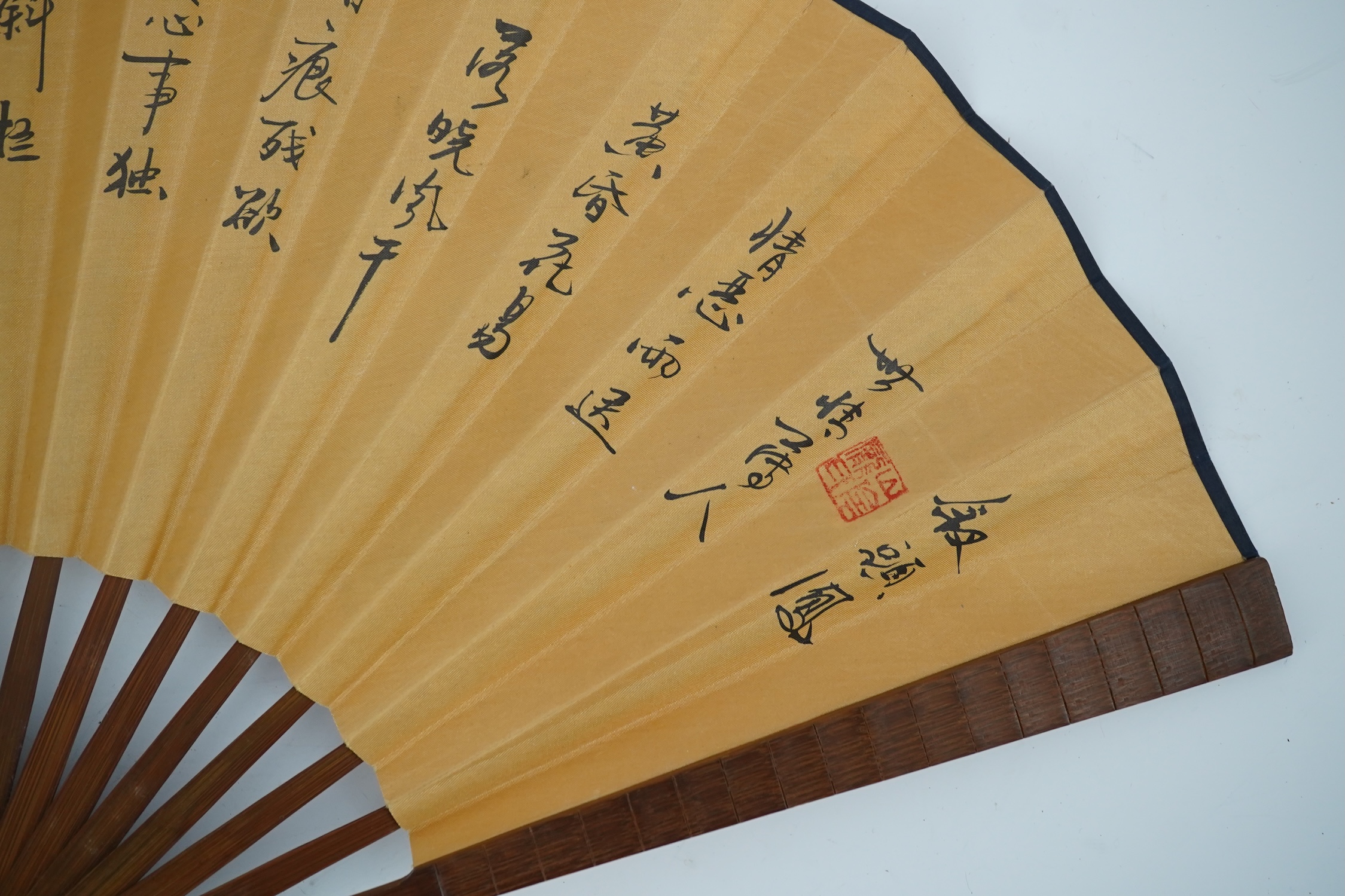 A fine Chinese sandalwood brise fan with finely carved sticks and guards, together with a mid 20th century silk calligraphic poetry LuYou fan, brise fan 38cm wide. Condition - minute damage to carving on one stick, sanda